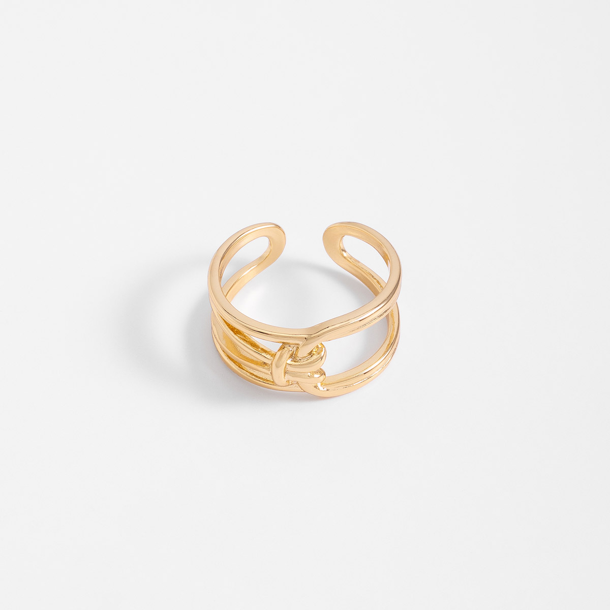 Anillo abierto en baño de oro diseño de líneas entrelazadas