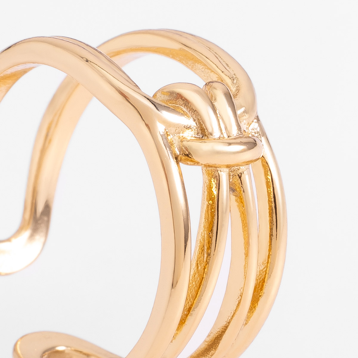 Anillo abierto en baño de oro diseño de líneas entrelazadas