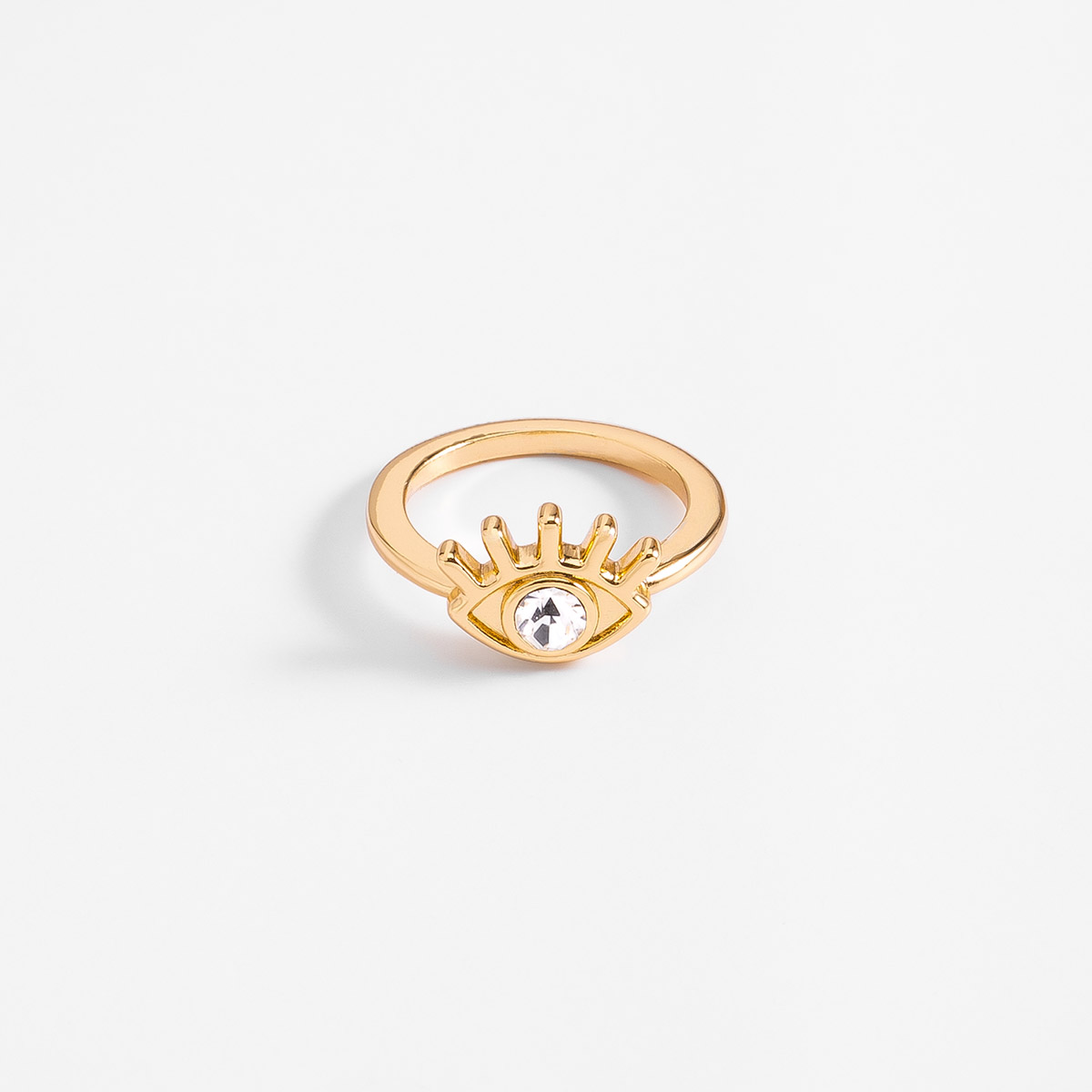 Anillo en baño de oro diseño ojo piedra en tono cristal