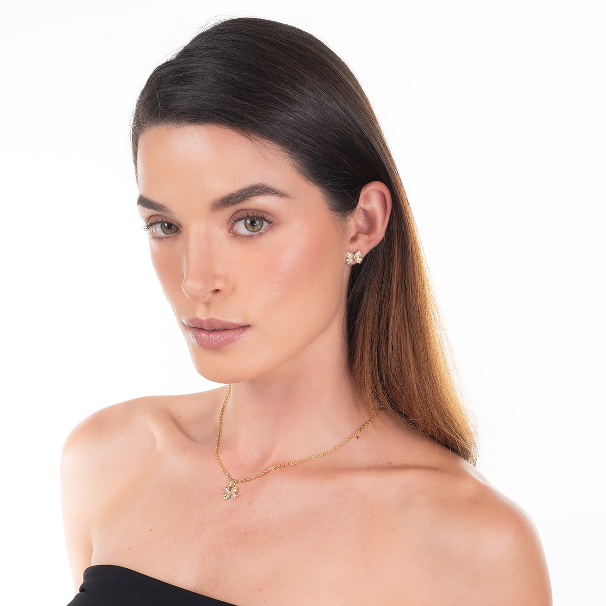 Aretes en baño de oro moño piedras toque brillante cristal