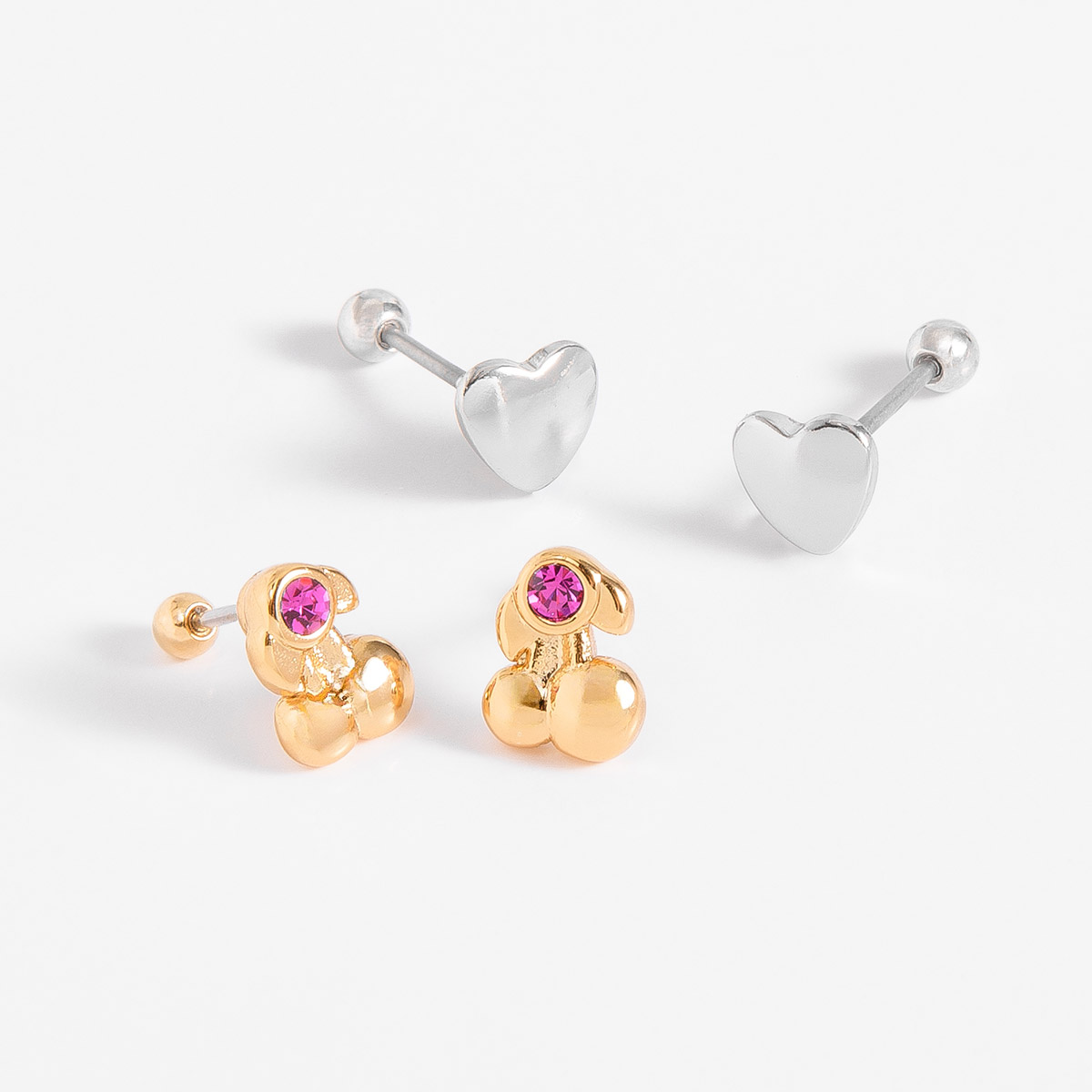 Dúo de aretes bitono en oro y platino con piedra fucsia