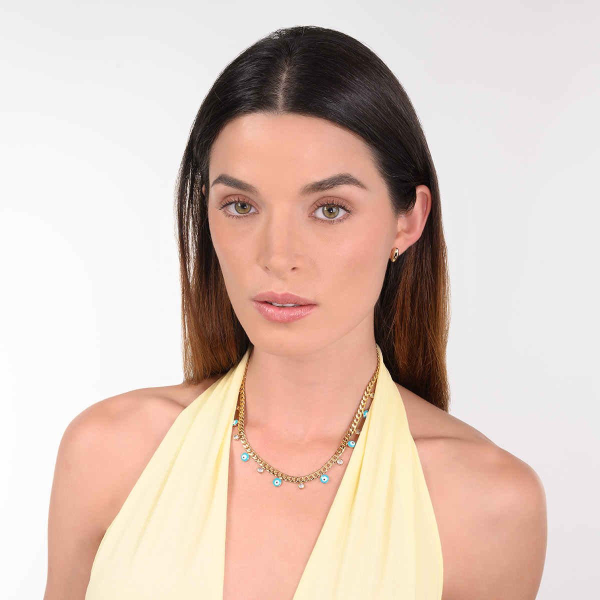 Aretes en baño de oro diseño ovalado pulido minimalista