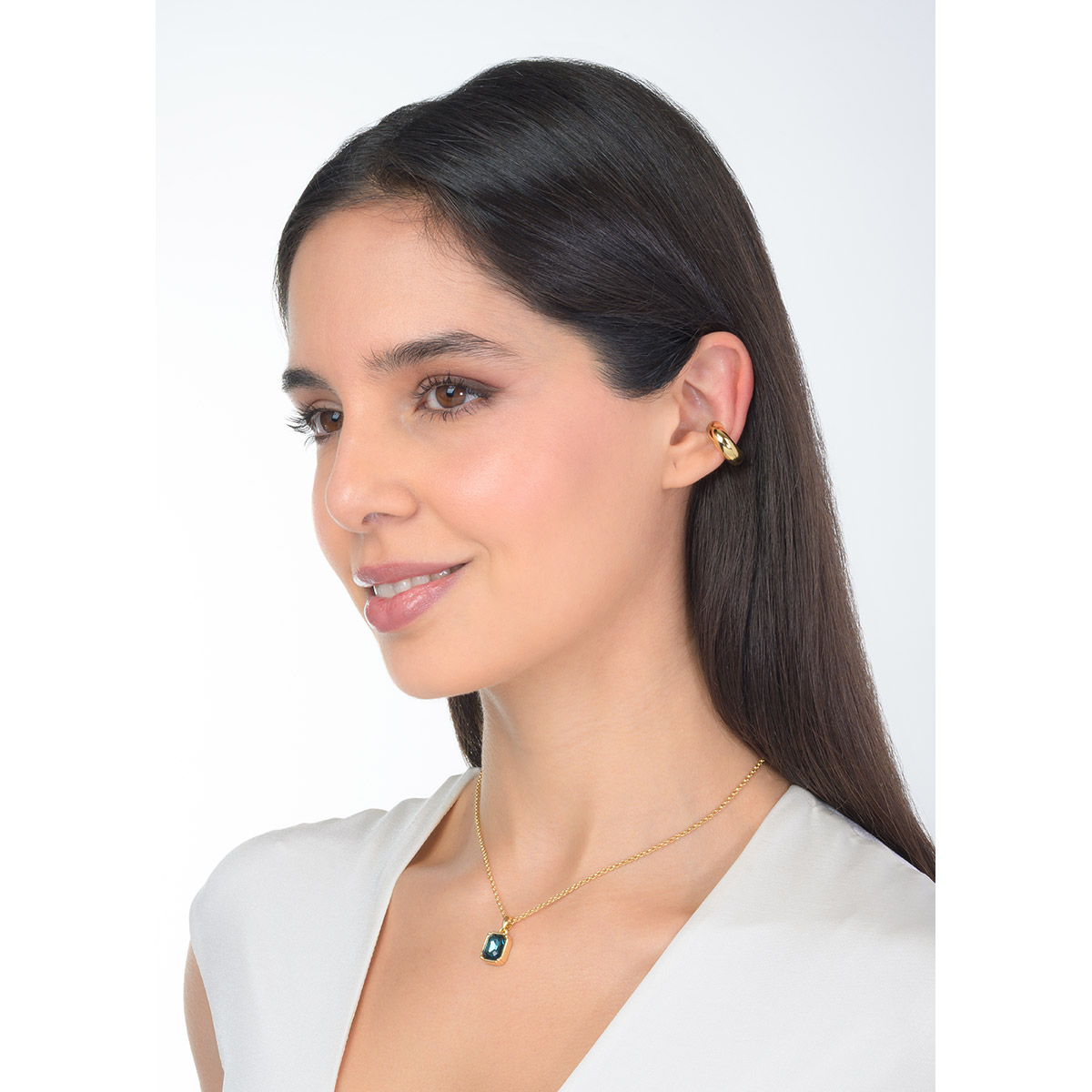 Gold plated ear cuff with a polished curved shape, a modern accessory adding versatility and personality to every look.