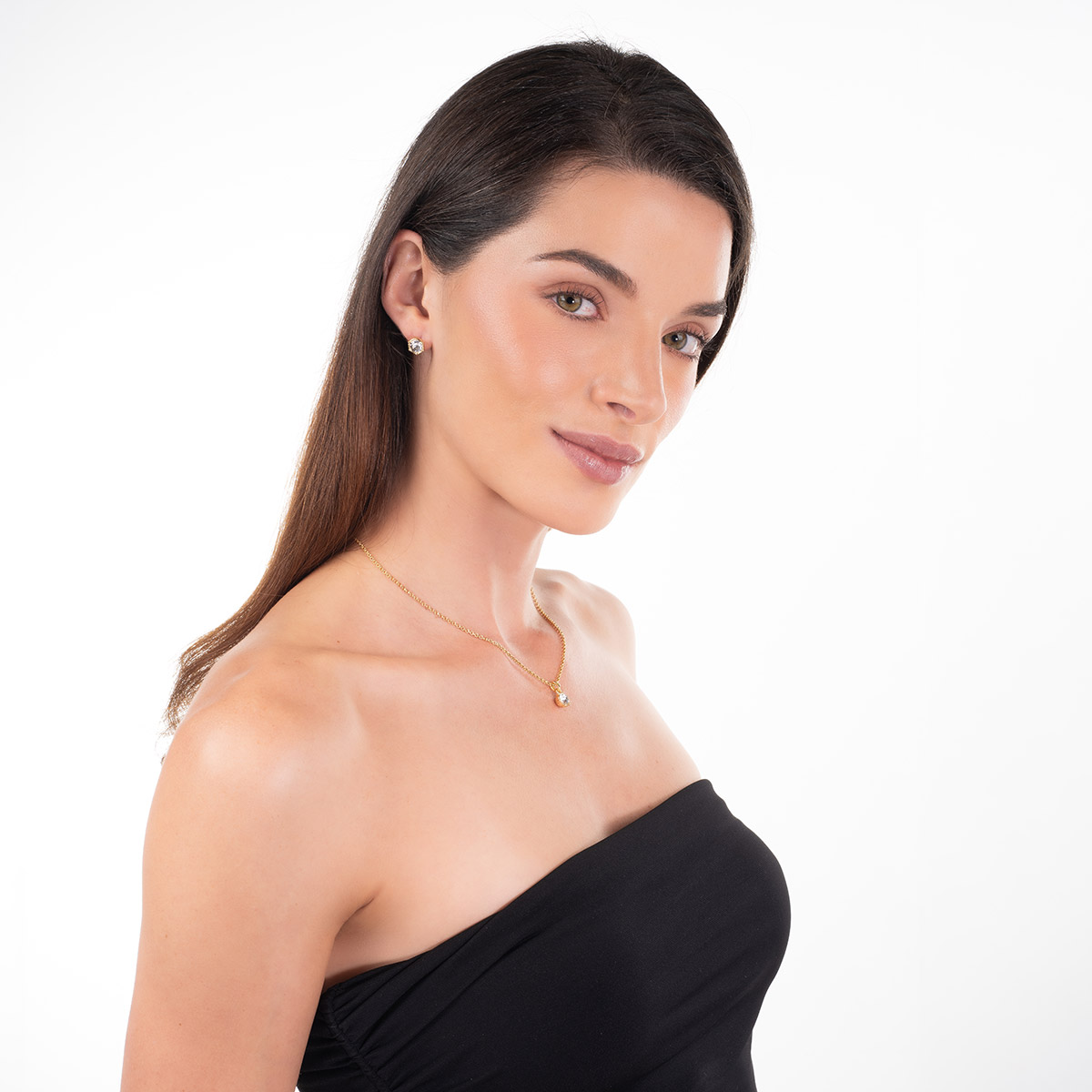 Aretes en baño de oro piedra central toque brillante redonda