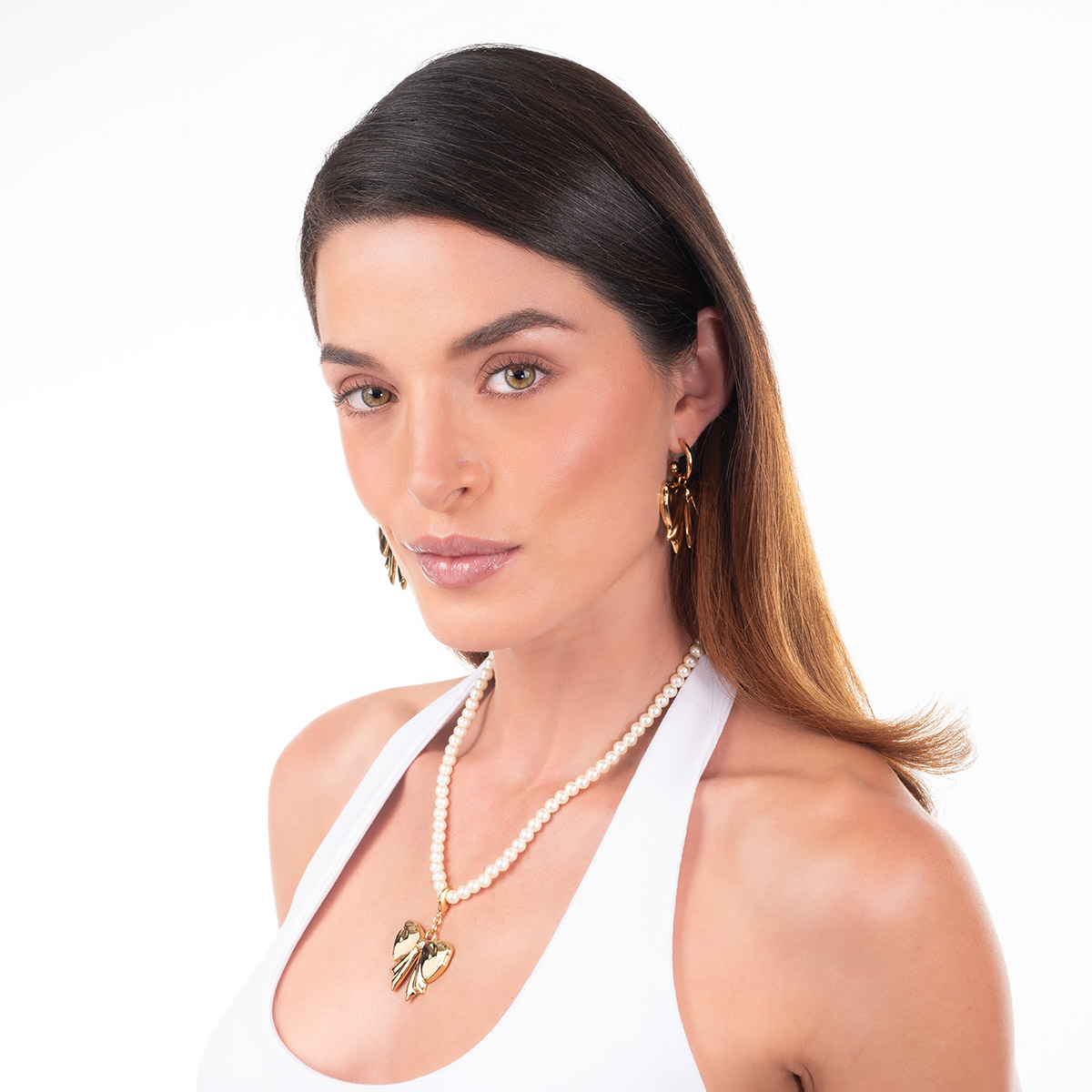 Aretes en baño de oro moño diseño pulido voluminoso