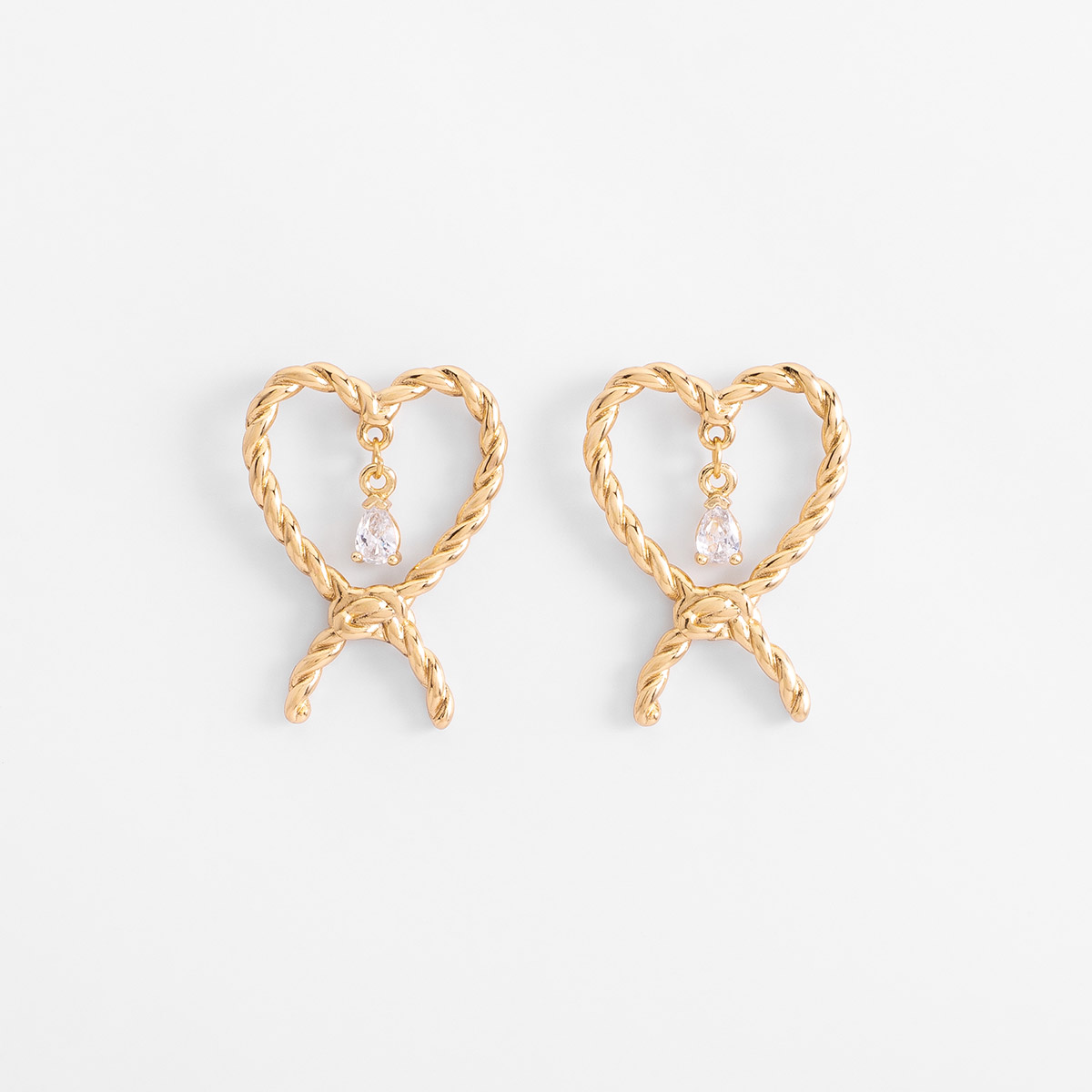 Aretes en baño de oro forma lazo y piedra brillante poste