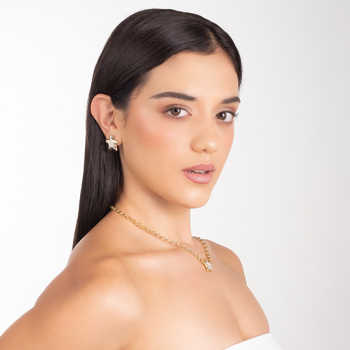 Aretes en baño de oro forma estrella piedras toque brillante