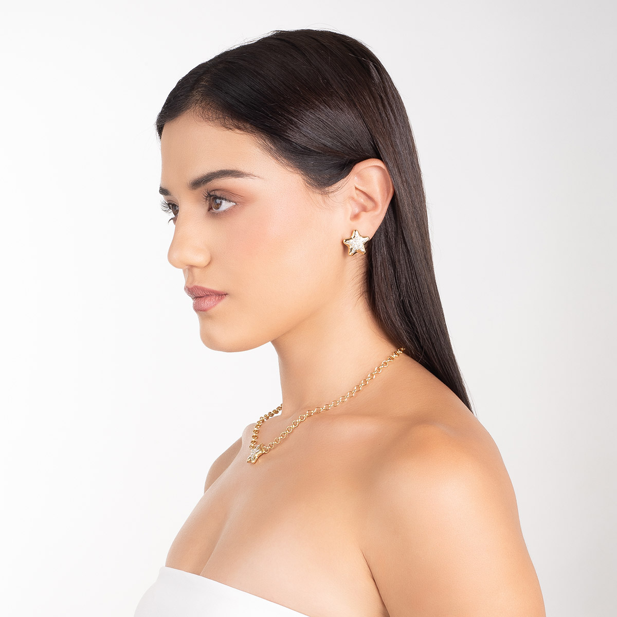 Aretes en baño de oro forma estrella piedras toque brillante