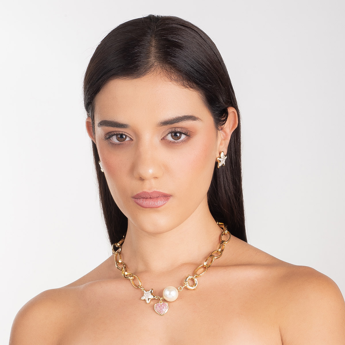 Aretes en baño de oro forma estrella piedras toque brillante