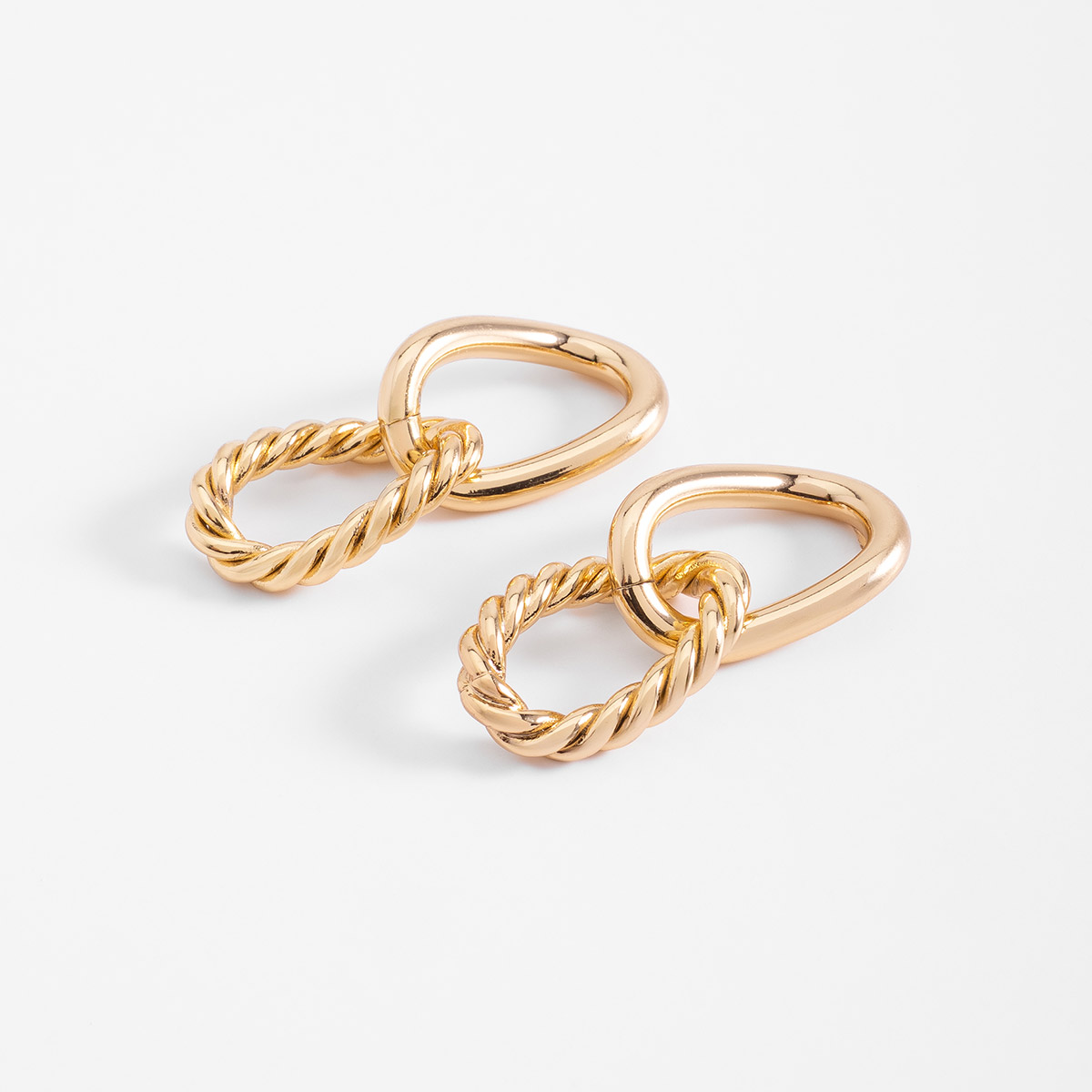 Aretes en baño de oro diseño doble elipse y trenzado 3.5 cm