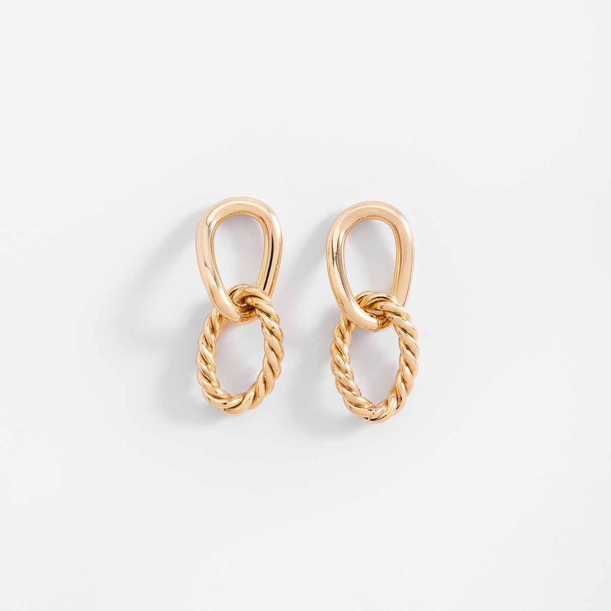Aretes en baño de oro diseño doble elipse y trenzado 3.5 cm