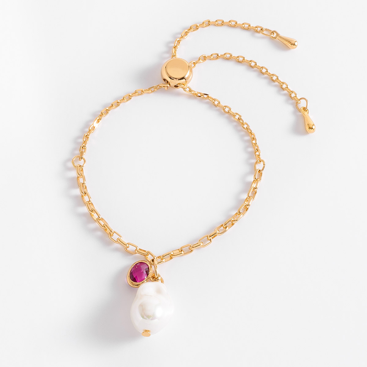 Pulsera perla ajustable en oro con piedra rosa