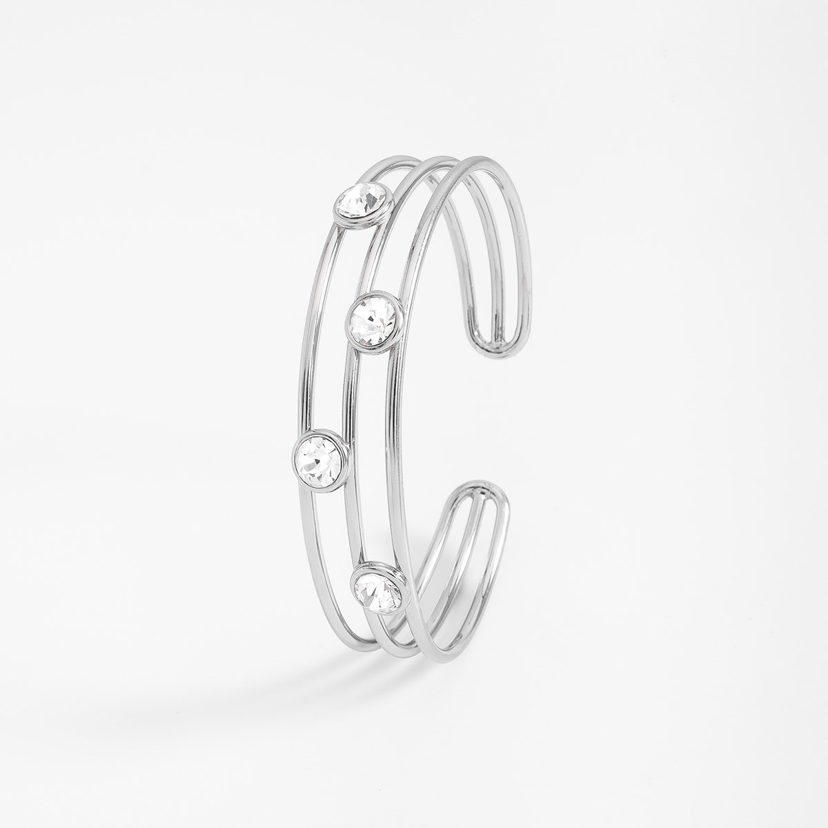 Pulsera rígida en baño de rodio con piedras en tono cristal