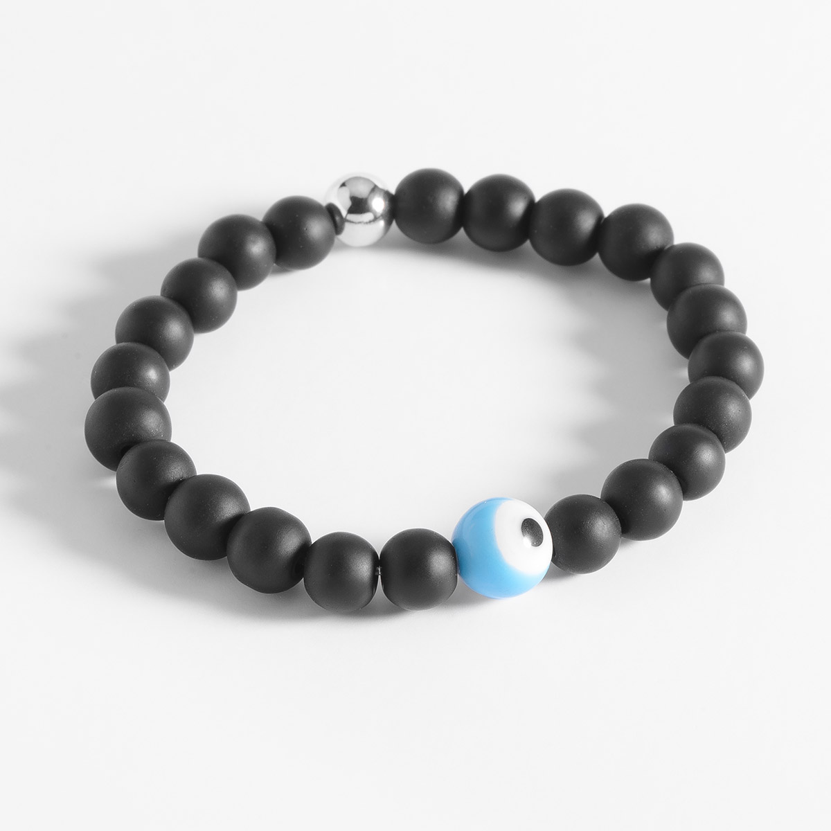 Pulsera con cuentas negras y dije de ojo turco