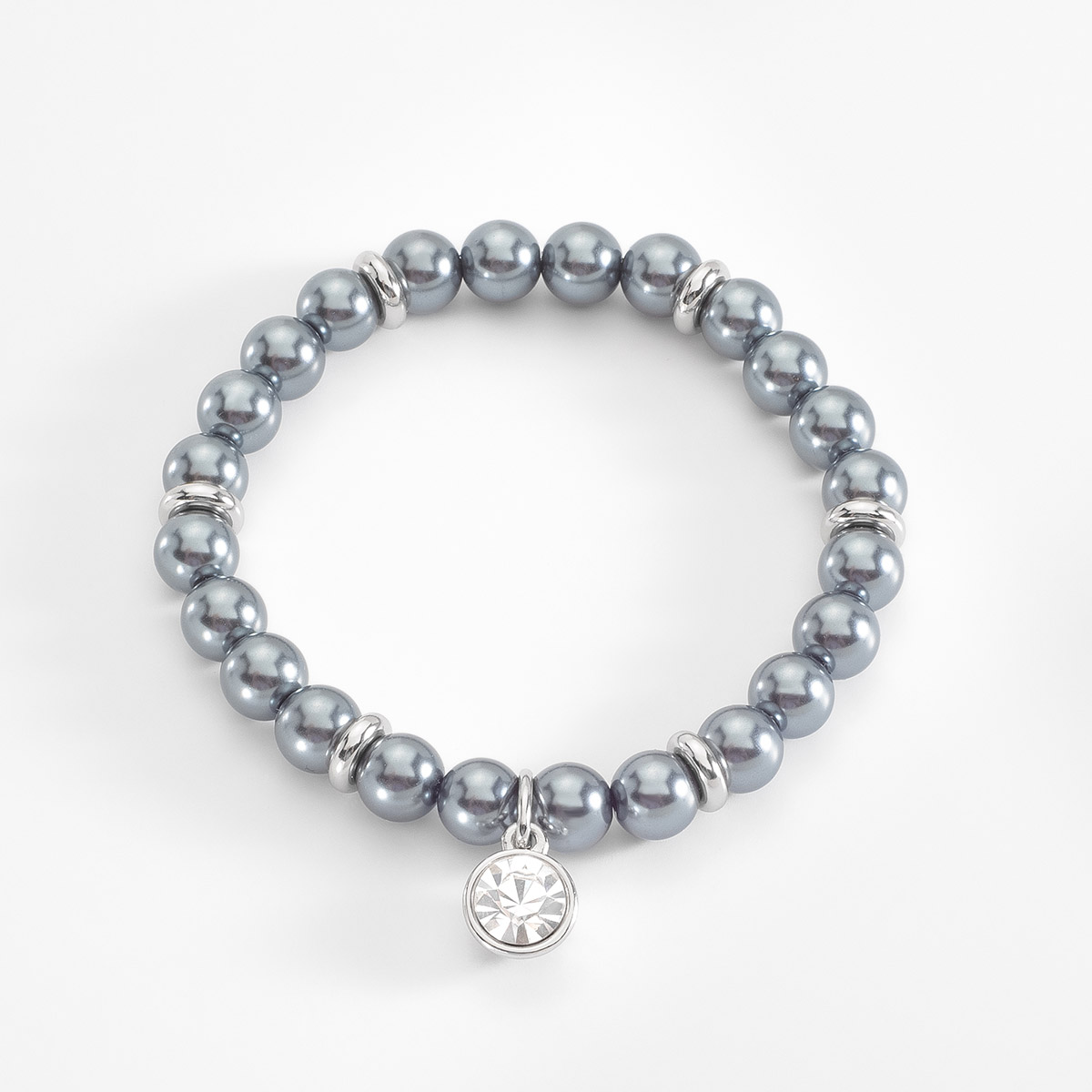 Pulsera elástica compuesta por perlas en tono gris, combinadas con detalles de cuentas en baño de platino y con un dije de piedra en tono cristal. Combínala con tus aretes y collar.
-        Pulsera
-        Medida única
-        Baño de Platino
-        Perlas en tono gris
-        Piedra en tono cristal
