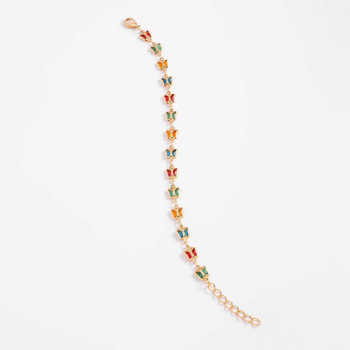 Pulsera en baño de oro con mariposas en tonos verde, azul, amarillo y rojo, un diseño alegre que aporta un matiz moderno y lleno de personalidad.