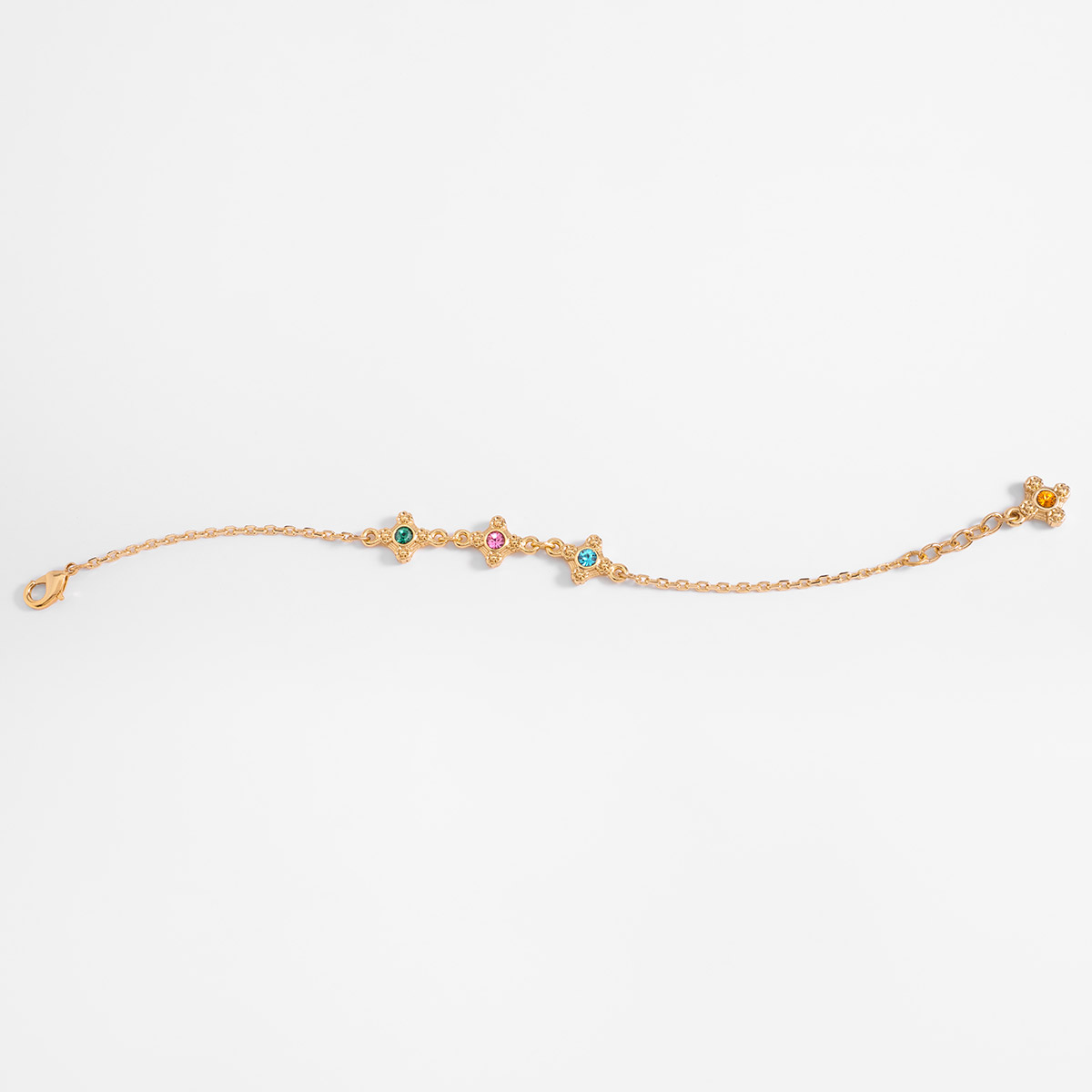 Pulsera en baño de oro con motivos decorativos y piedras de color