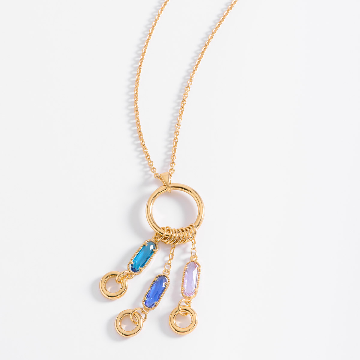 Collar con dije baño de oro con piedras turquesa y azul