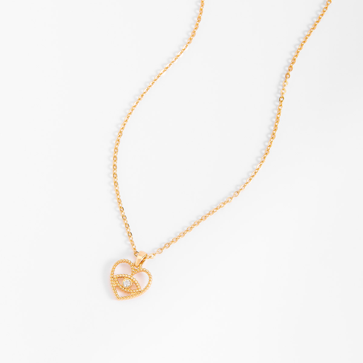 Collar en baño de oro con dije corazón y ojo turco Collar en baño de oro con dije corazón y ojo turco