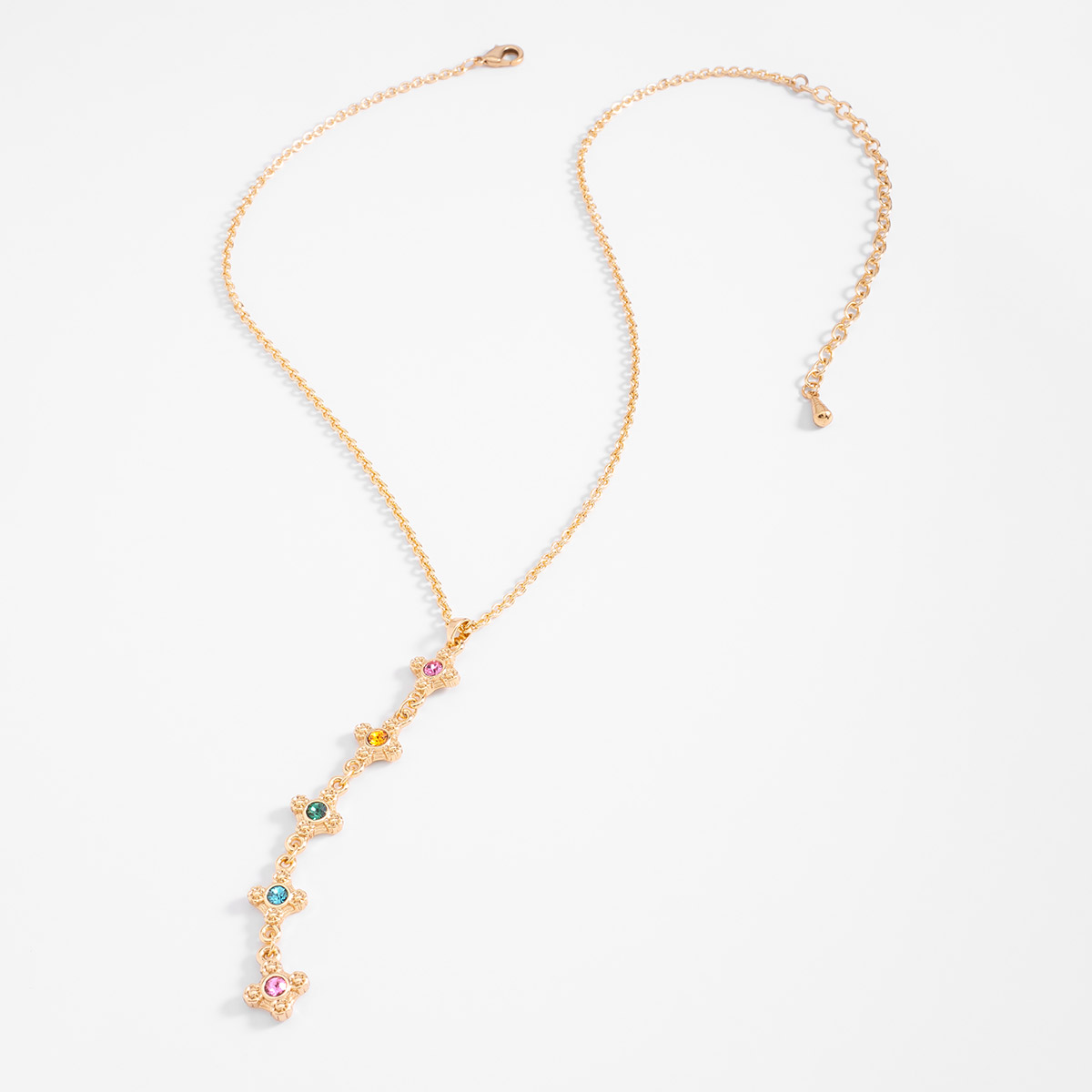 Collar en baño de oro con dije vertical y piedras coloridas