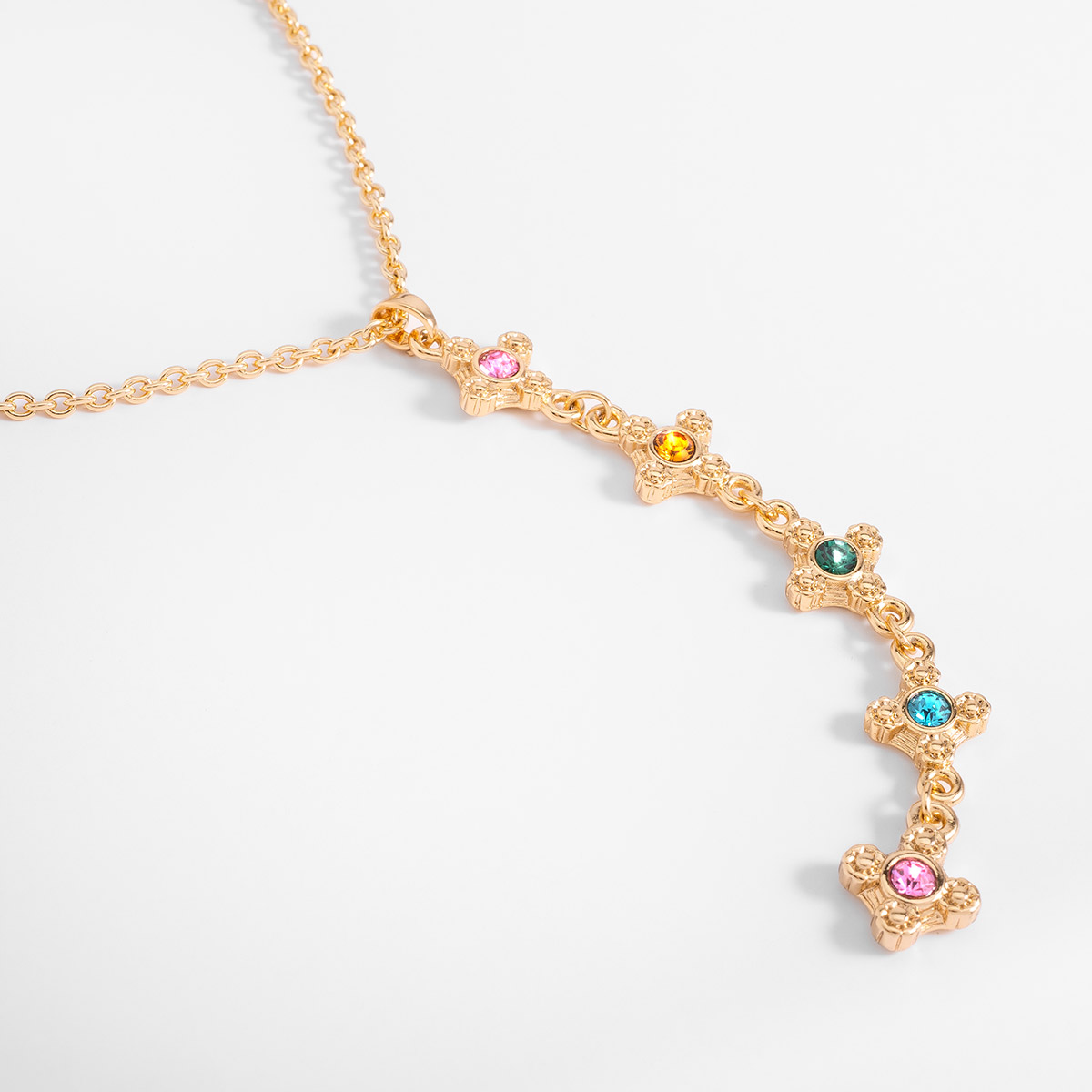 Collar en baño de oro con dije vertical y piedras coloridas