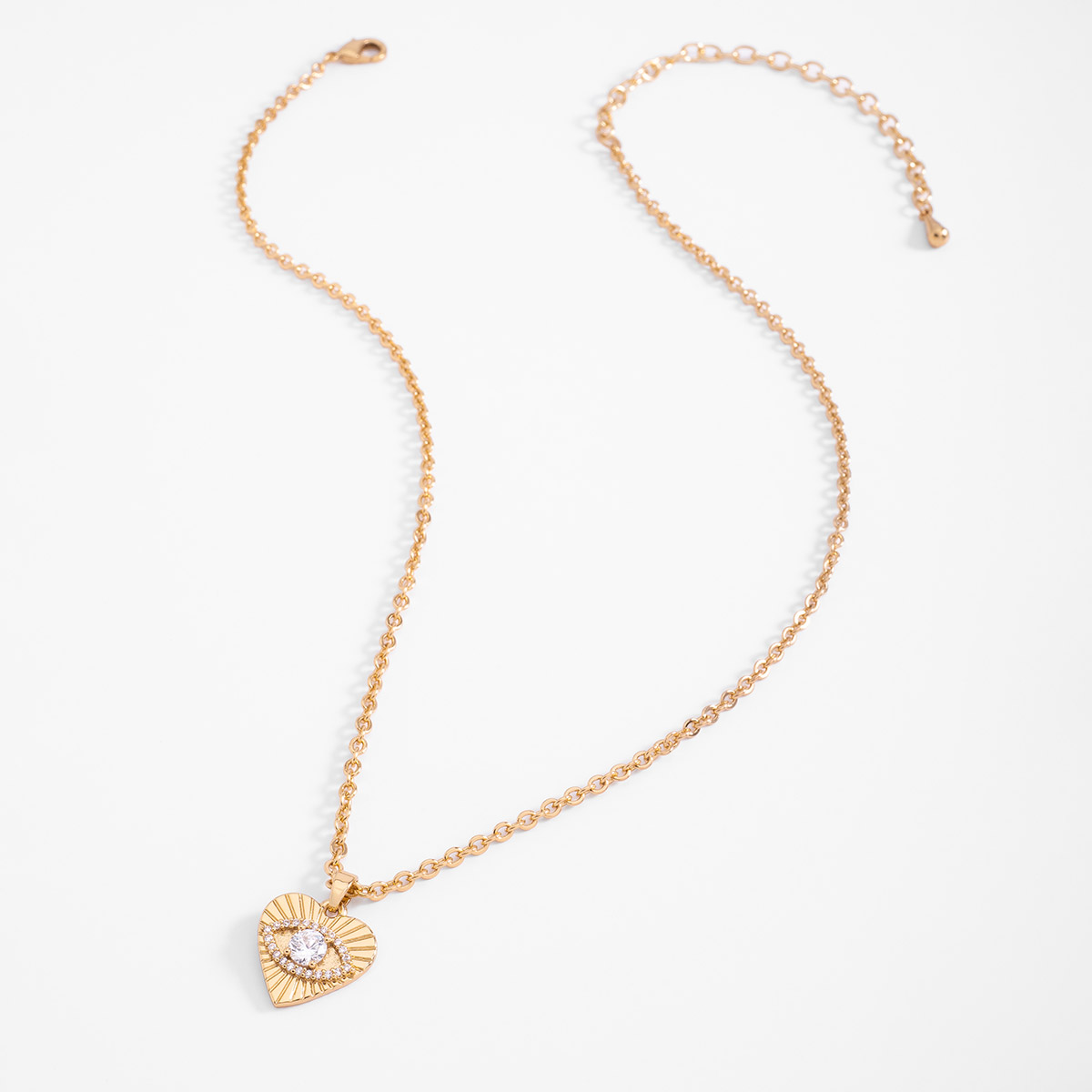 Collar en baño de oro dije corazón con piedras en tono cristal