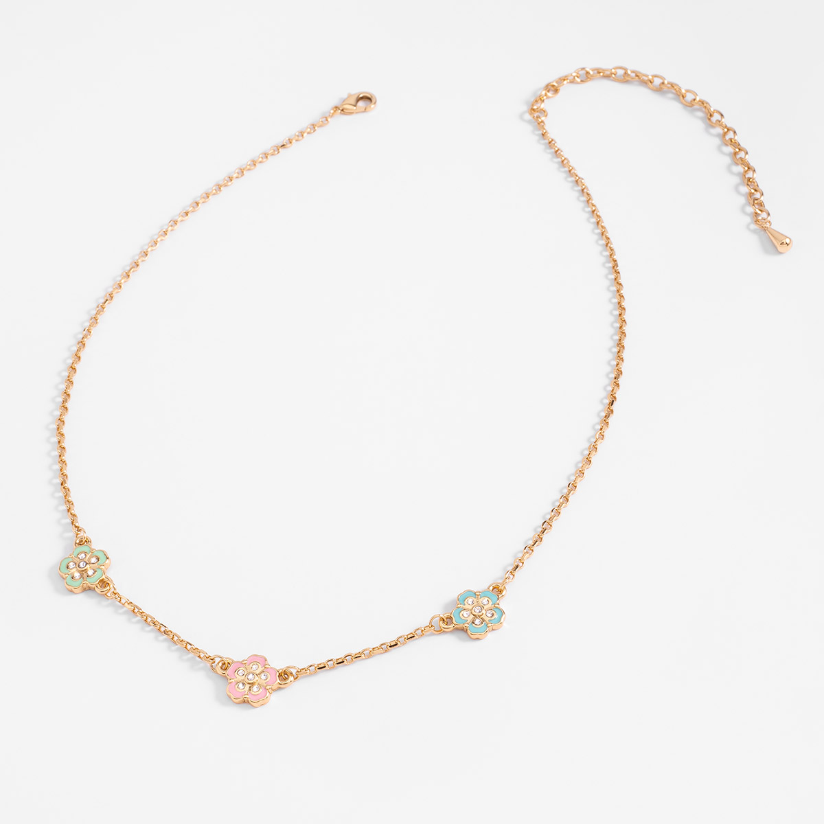 Collar en baño de oro con flores y esmalte en tonos pastel
